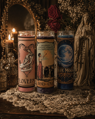 pink glass encased candles with Erzulie Freda's ritual symbol shaped like a heart.