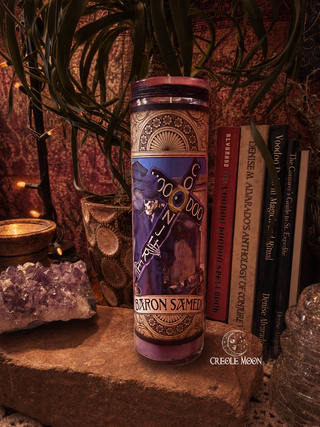 Candle with decorative label on a mystical setting with books and crystals