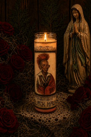 Candle with a portrait and 'Black History' text, surrounded by red roses and a statue, on a dark background.