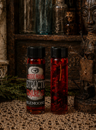 Two bottles of Destruction oil on a lace doily 