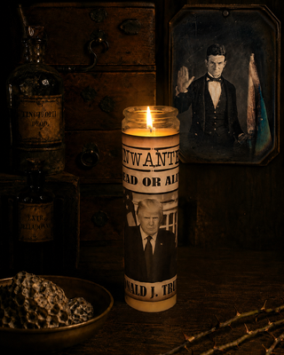 Candle with a portrait of a man on a dark background