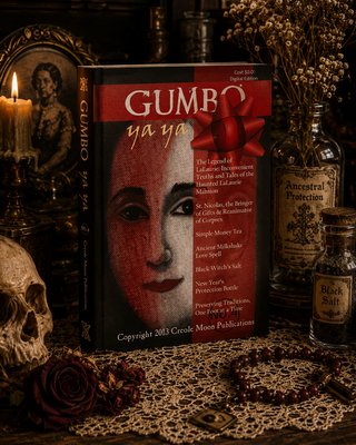 Book titled 'Gumbo ya ya' with a red cover featuring a face, surrounded by mystical items on a table.