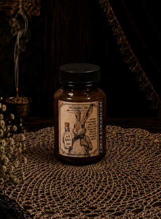 Brown bottle with "Jack Rabbit Dust" label on a textured surface with dark background