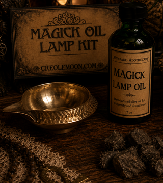 Magick oil lamp kit with bottle, lamp, and ingredients on a wooden surface.