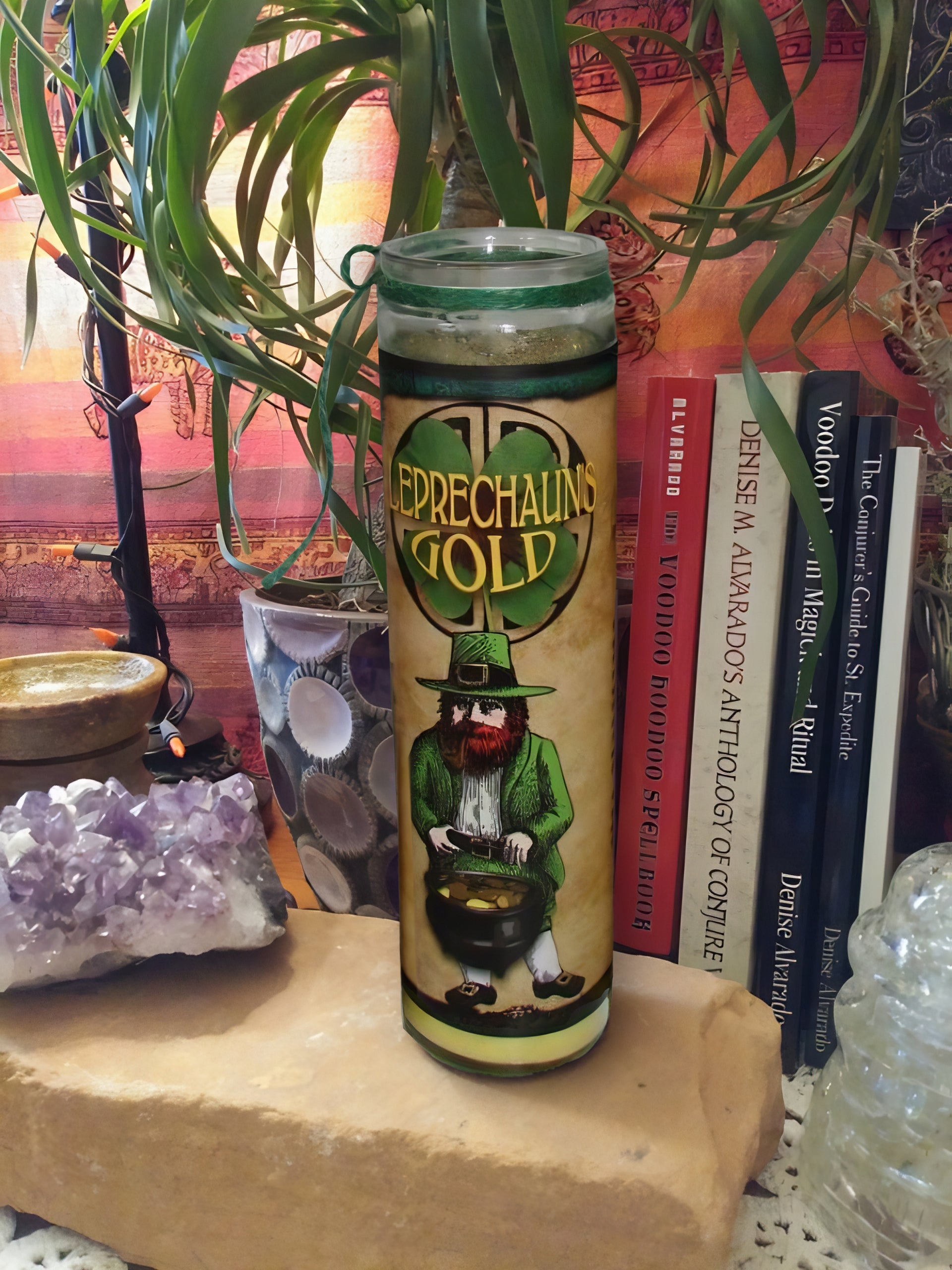 Leprechaun's Gold Candle with green and gold accents, glass-encased, set for ritual use