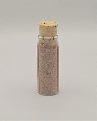 Banishing Conjure Powder in a glass corked bottle.